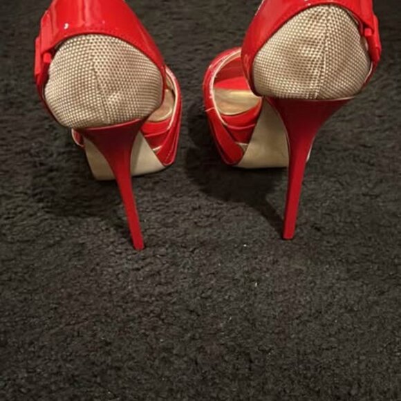 This is a pair of red women's high-heel sandals from the bebe brand. - Picture 2 of 4
